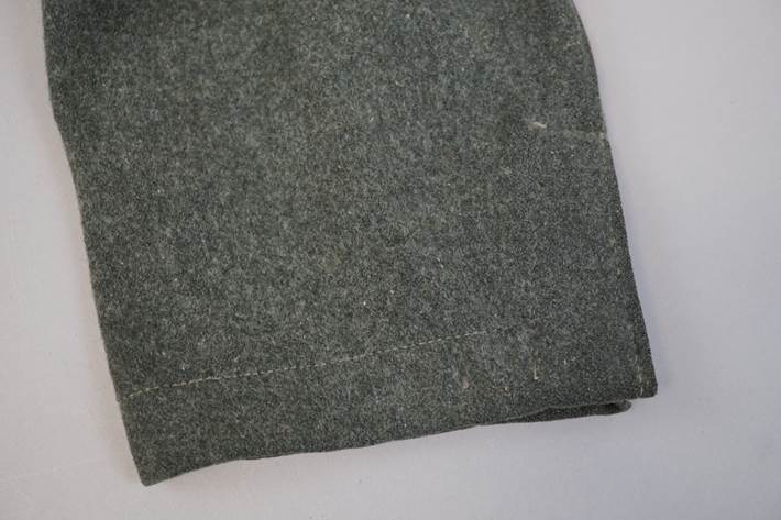 A close-up of a grey cloth

Description automatically generated