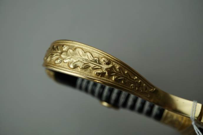 Close-up of a gold ring

Description automatically generated