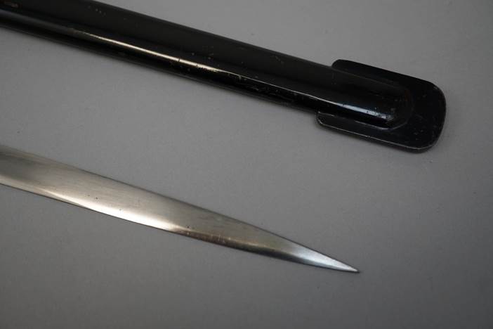 A close-up of a sharp knife

Description automatically generated