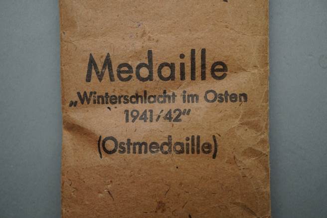 A brown paper bag with black text

Description automatically generated