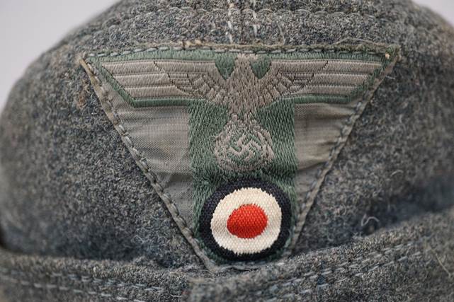 A close-up of a military hat

Description automatically generated