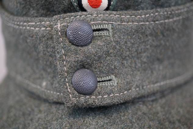 Buttons on a gray jacket

Description automatically generated with medium confidence