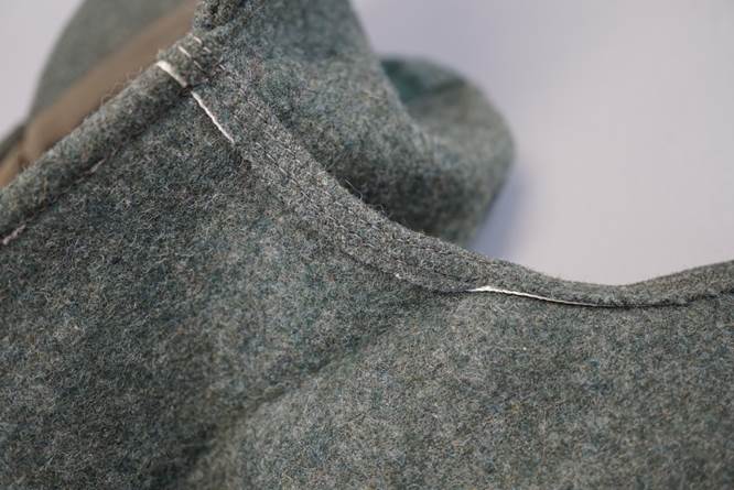A close-up of a grey fabric

Description automatically generated