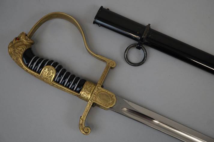A sword and a black cylinder

Description automatically generated with medium confidence