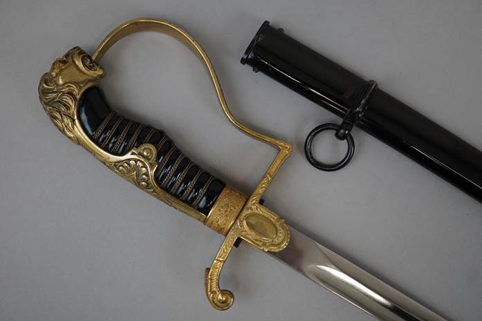 A sword with a black handle

Description automatically generated