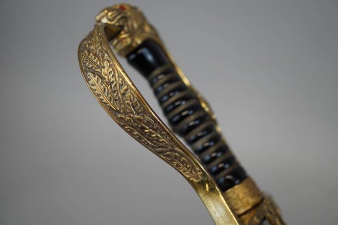 Close-up of a sword handle

Description automatically generated