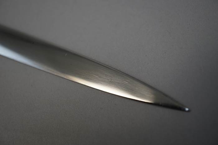 Close-up of a sharp knife

Description automatically generated