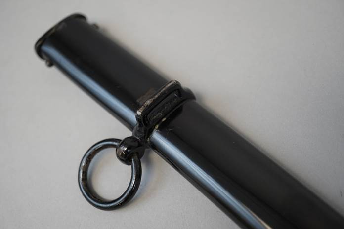 Close-up of a black cylinder

Description automatically generated