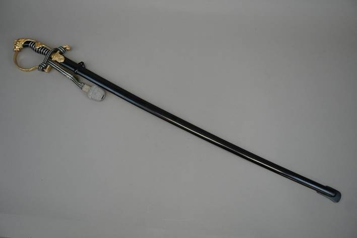 A long sword with a handle

Description automatically generated