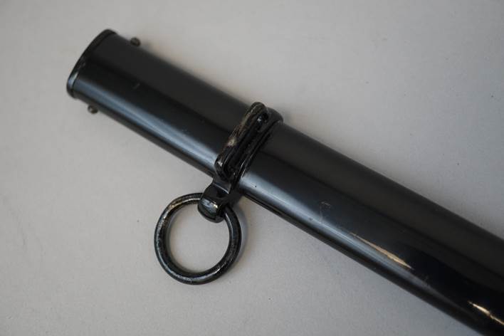 A black cylinder with a ring

Description automatically generated