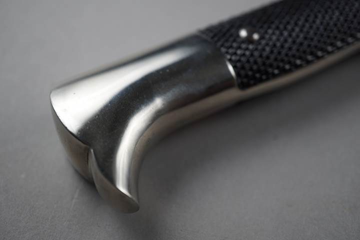 Close-up of a knife handle

Description automatically generated