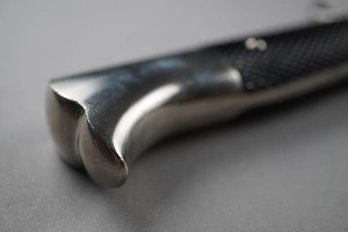 Close-up of a knife's handle

Description automatically generated