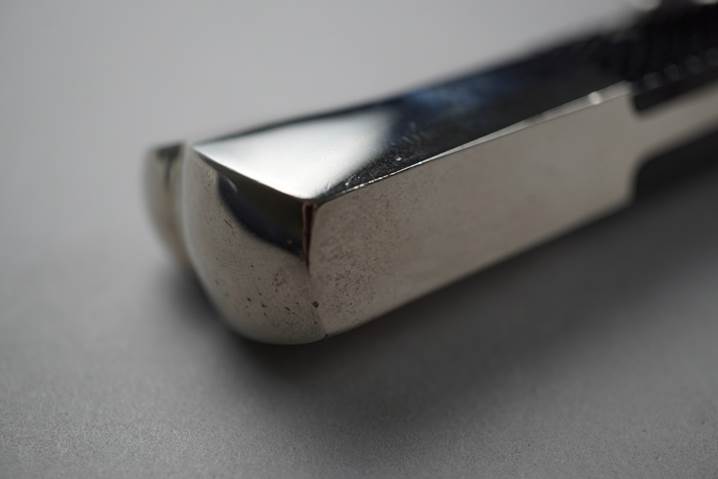 Close-up of a metal tool

Description automatically generated