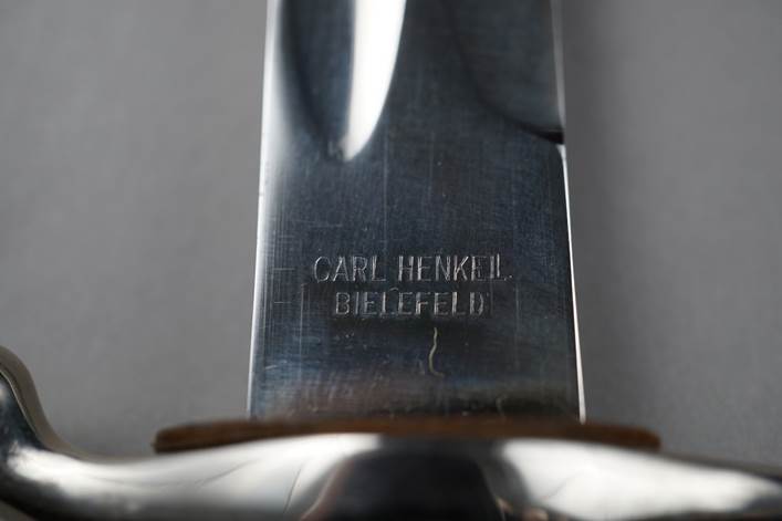 Close-up of a knife's blade

Description automatically generated