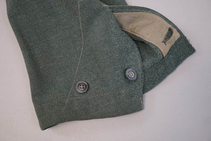 A close-up of a green jacket

Description automatically generated