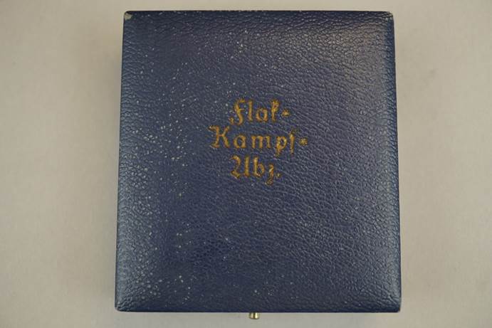 A blue leather book with gold text

Description automatically generated