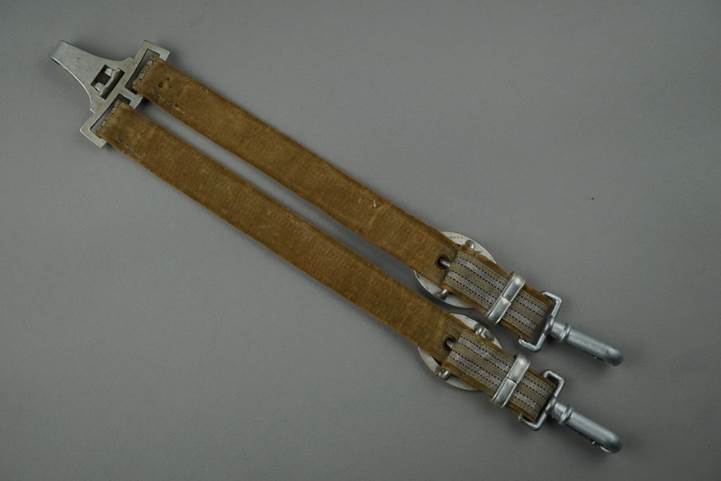 A pair of brown straps

Description automatically generated