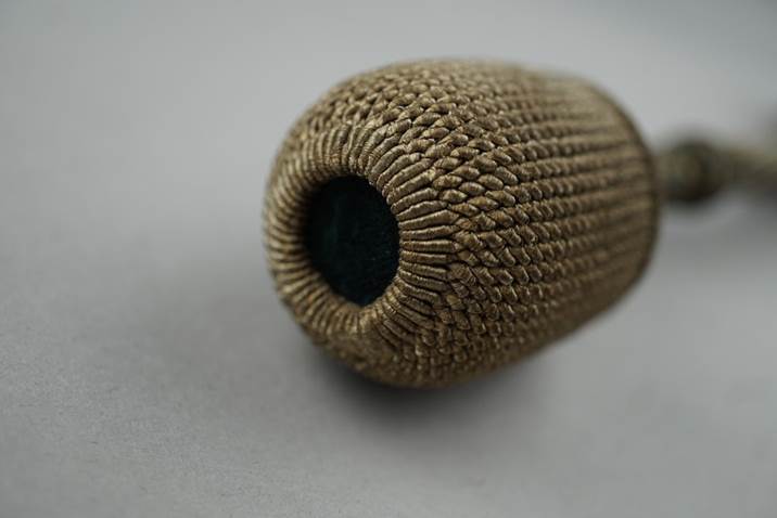 A close-up of a knitted object

Description automatically generated