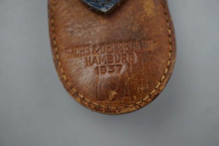 A close-up of a leather shoe

Description automatically generated