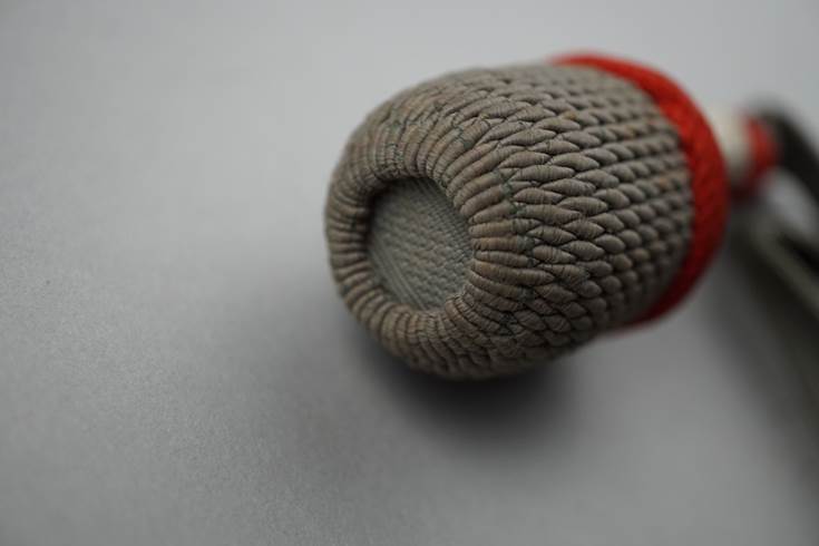 A close-up of a knitted object

Description automatically generated