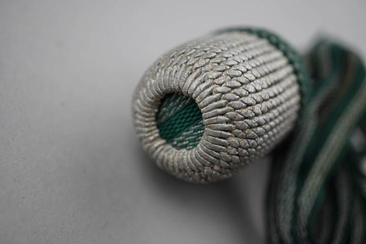 Close-up of a rope wrapped object

Description automatically generated