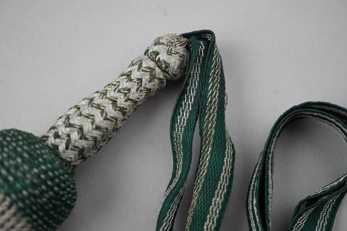 Close-up of a green and white rope

Description automatically generated