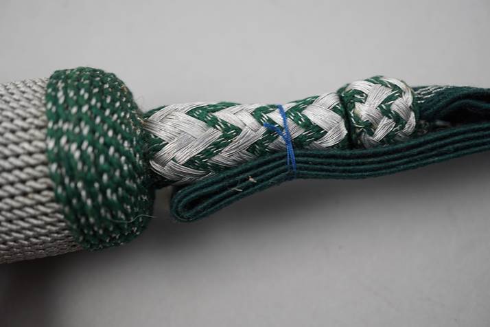 Close-up of a green and white rope

Description automatically generated