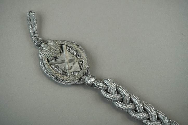 A close-up of a silver bracelet

Description automatically generated