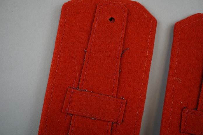 Close-up of a red felt bookmark

Description automatically generated