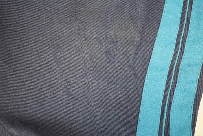 A close-up of a blue and black fabric

Description automatically generated