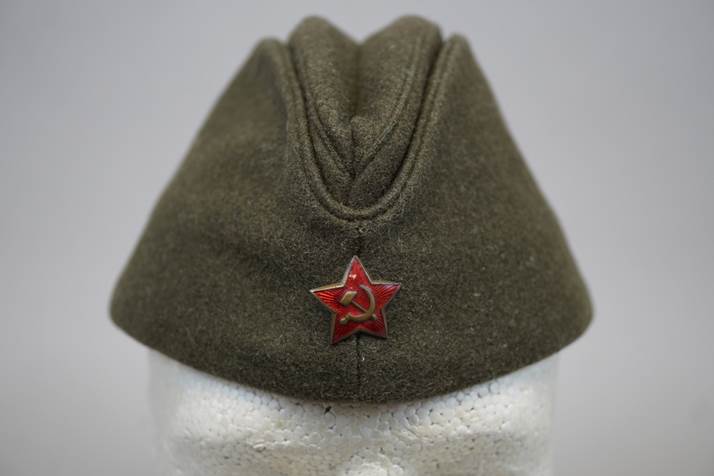 A hat with a red star

Description automatically generated