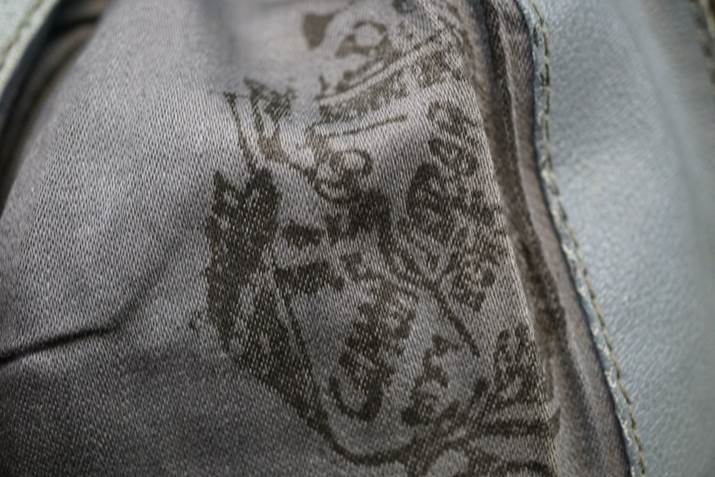 A close-up of a fabric with a logo

Description automatically generated