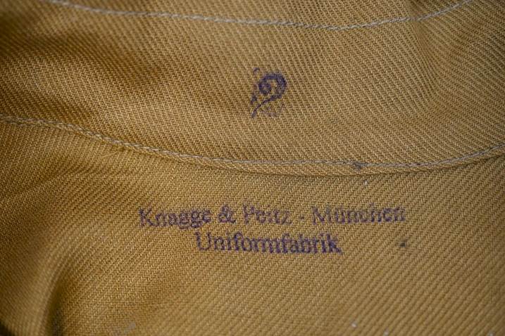 Close-up of a fabric with a logo

Description automatically generated