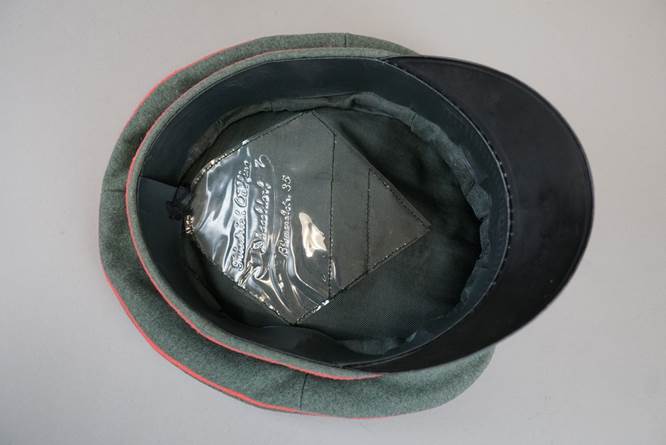 A hat with a plastic bag

Description automatically generated