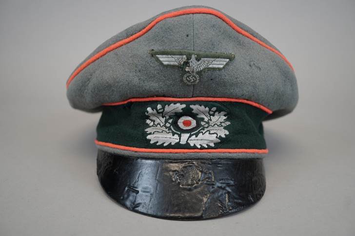 A grey hat with a green and white patch

Description automatically generated