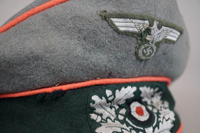 Close-up of a military hat

Description automatically generated
