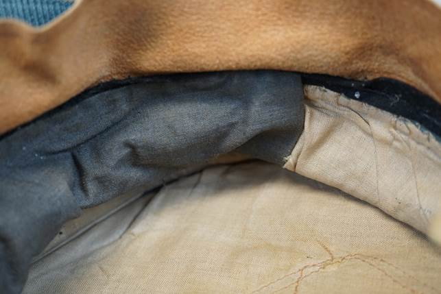 A close-up of a brown and black fabric

Description automatically generated