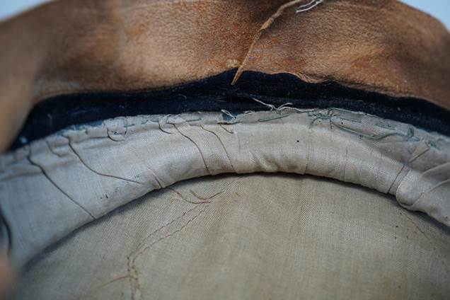 Close-up of a leather cushion

Description automatically generated