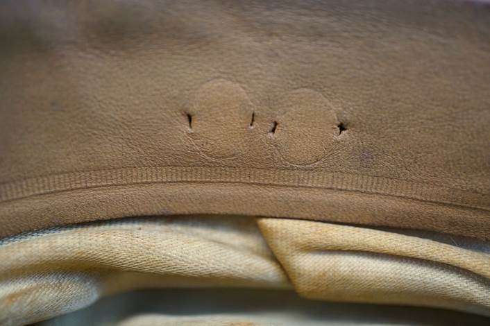 A close-up of a brown fabric

Description automatically generated