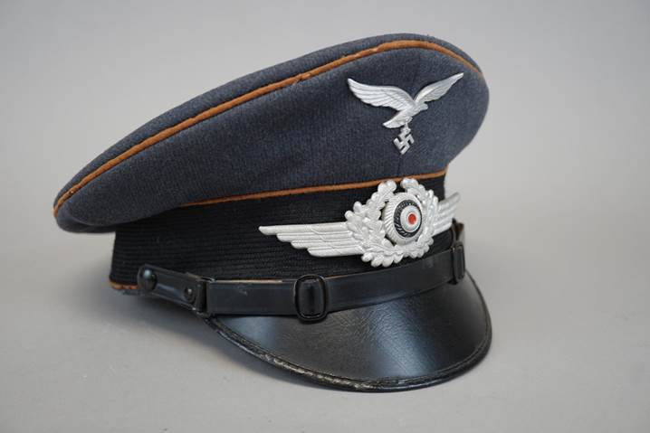 A black hat with a white emblem

Description automatically generated
