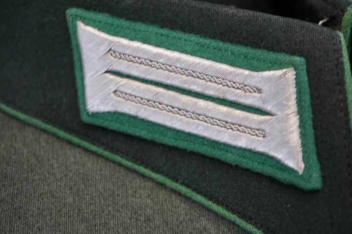 A close-up of a green and white patch

Description automatically generated
