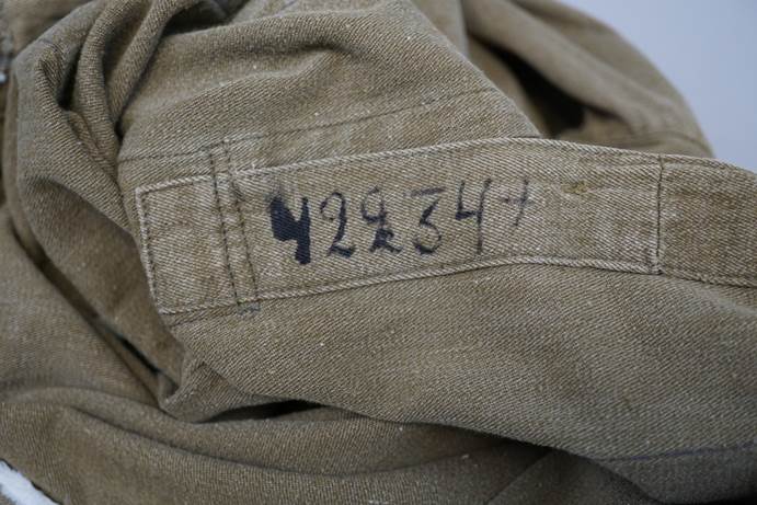 A close-up of a fabric with numbers

Description automatically generated