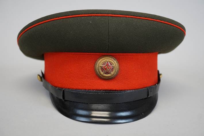 A red and black hat with a star on the side

Description automatically generated
