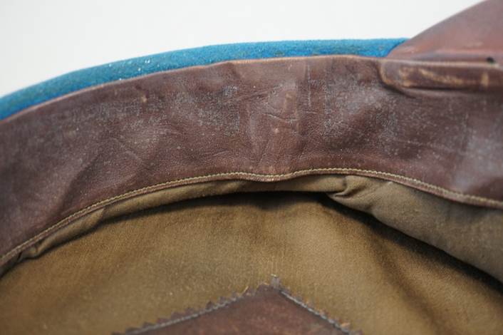 Close-up of a leather patch on a hat

Description automatically generated