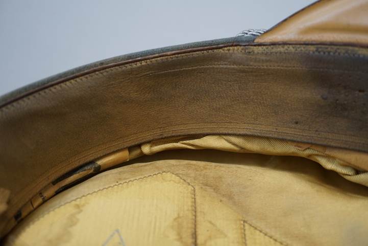 A close-up of a leather hat

Description automatically generated