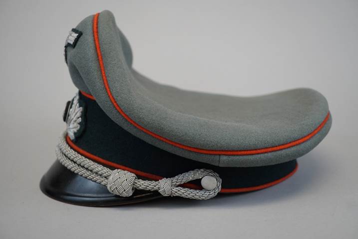 A grey hat with red and blue trim

Description automatically generated