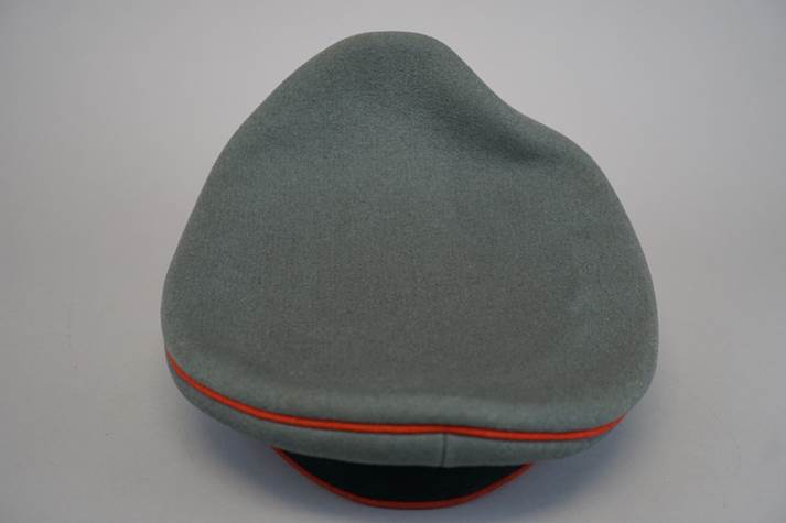 A grey hat with red trim

Description automatically generated