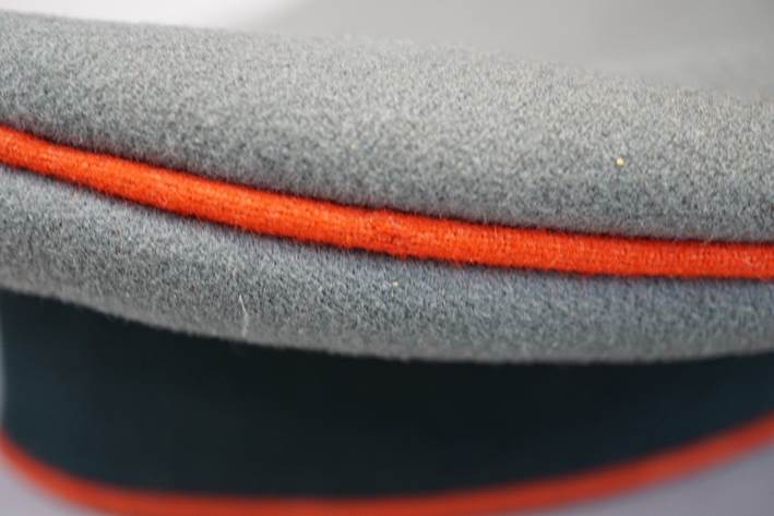 A close-up of a grey hat

Description automatically generated