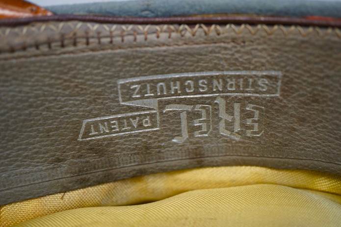 Close-up of a leather label

Description automatically generated