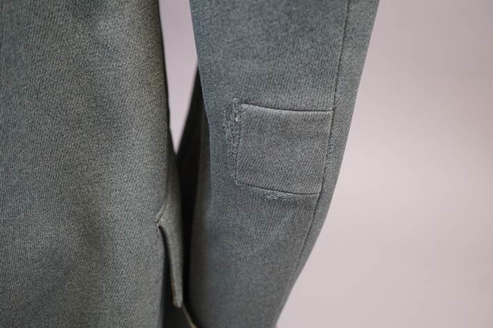 A close-up of a suit jacket

Description automatically generated